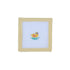Cross-stitched design of a yellow duck in a green pond on white fabric with a beige frame.